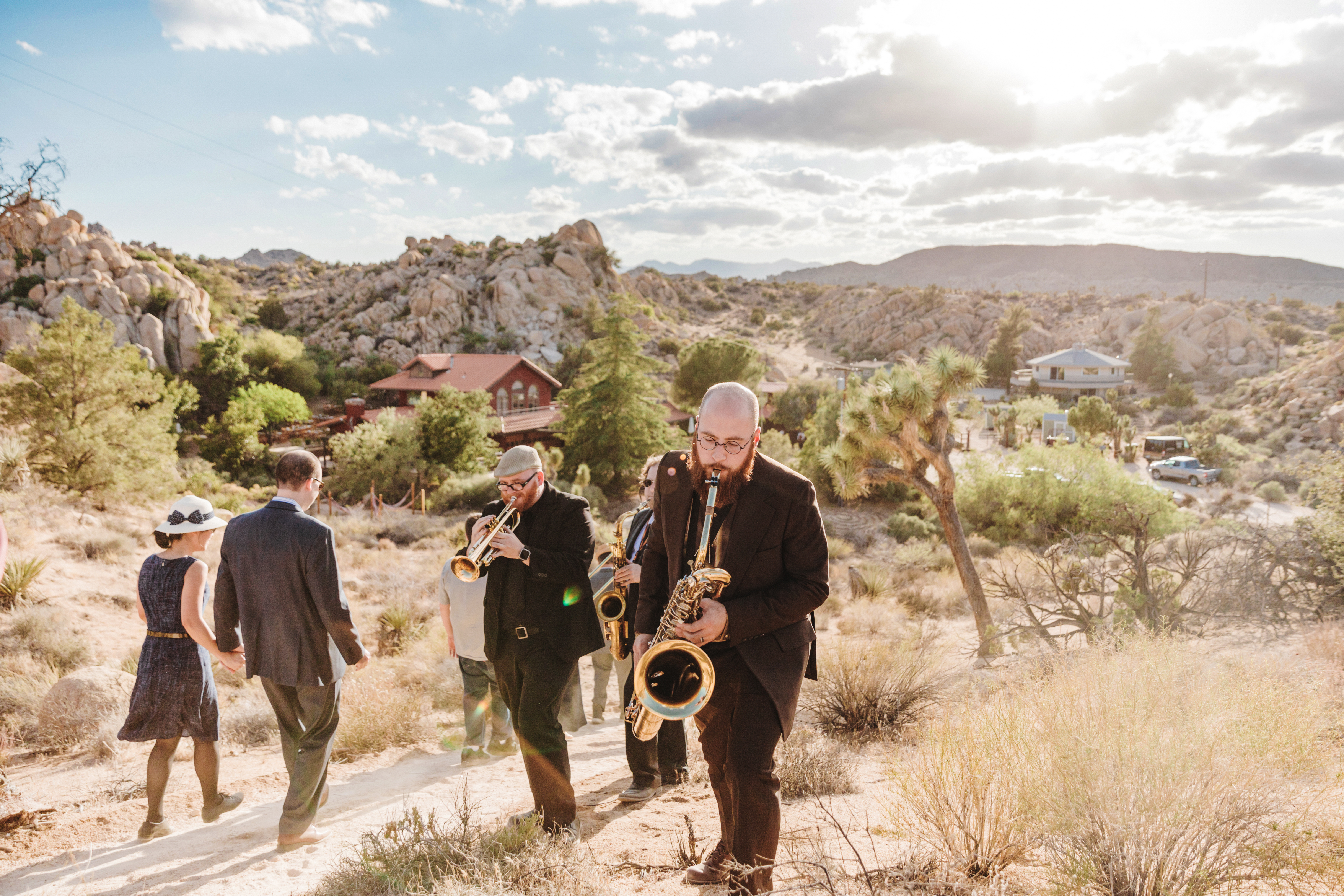 The walk down to the barn from the ceremony accompanied by a Dixie Jazz Band